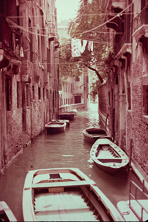 ROWBOATS ON A VENICE CANAL