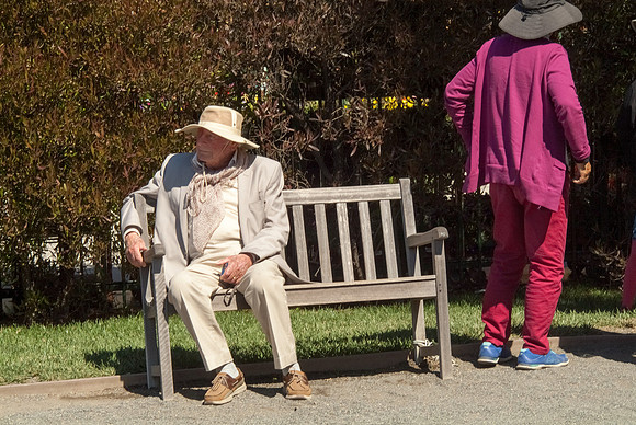 OLD MAN WITH HAT ON BENCH