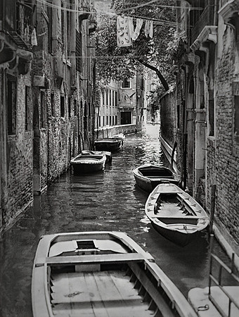 ROWBOATS ON A VENICE CANAL