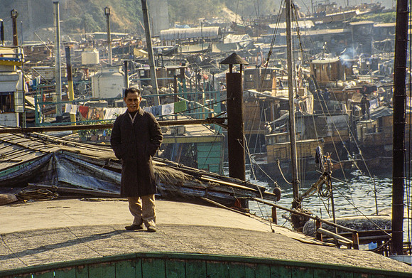 MAN STANDING ON KOWLOON ROOFTOP